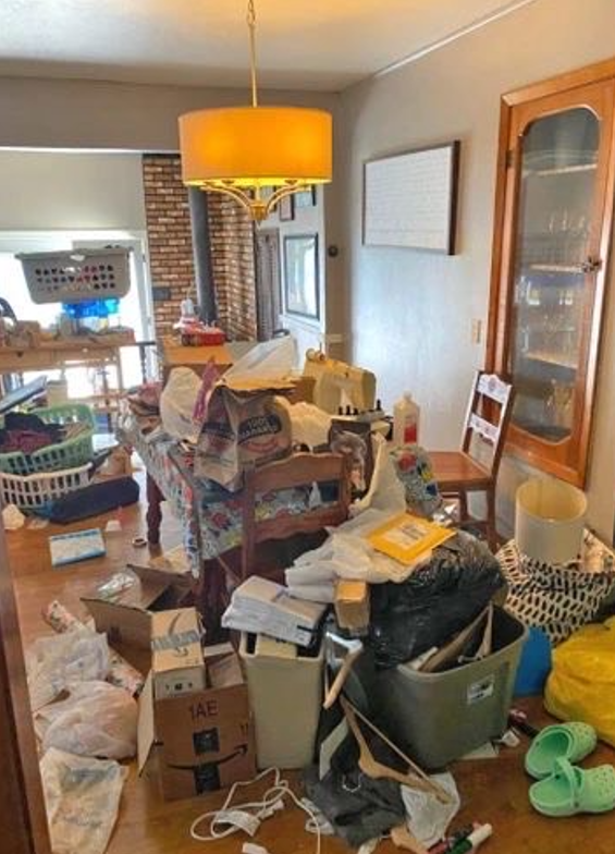 Before cleaning - cluttered room